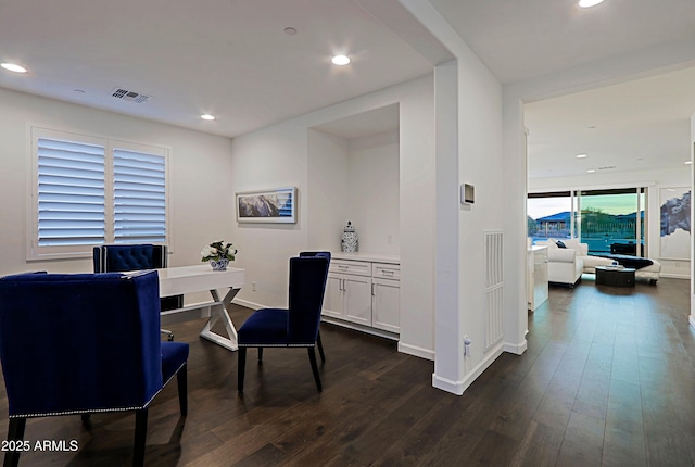 dining room with dark wood-type flooring