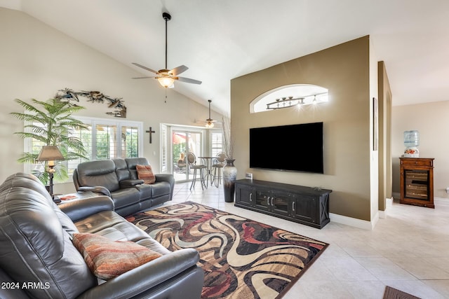 living room with high vaulted ceiling, ceiling fan, baseboards, and light tile patterned flooring