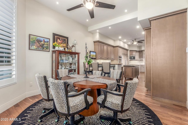 dining room with ceiling fan, baseboards, light wood finished floors, and recessed lighting