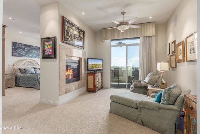 living room with a tiled fireplace, carpet floors, visible vents, ceiling fan, and recessed lighting