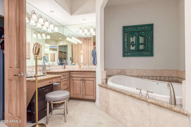 full bathroom featuring vanity and a bath