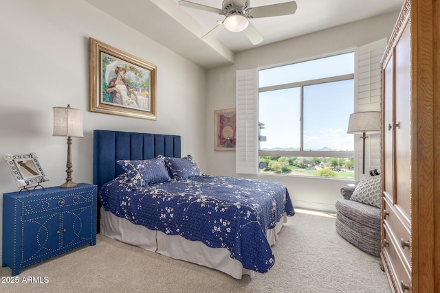 carpeted bedroom with multiple windows and ceiling fan
