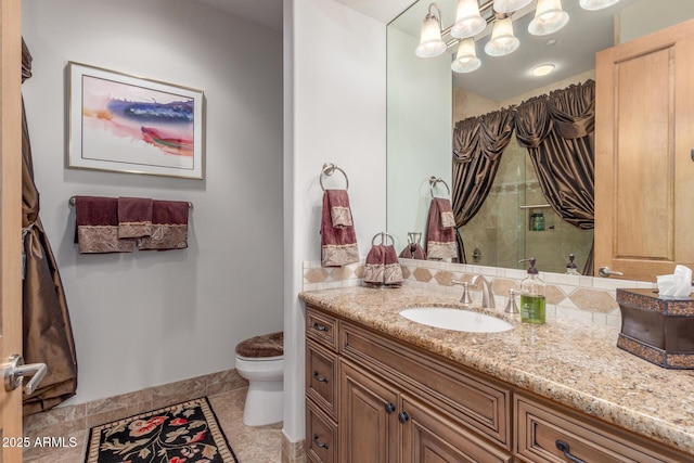 bathroom with toilet, baseboards, a tile shower, tile patterned flooring, and vanity