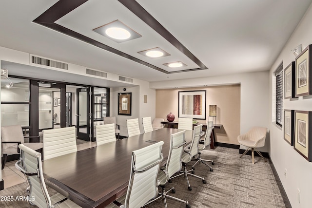 office area featuring baseboards and visible vents