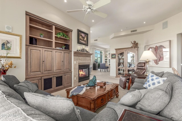 living area with visible vents, recessed lighting, light carpet, a ceiling fan, and a tile fireplace