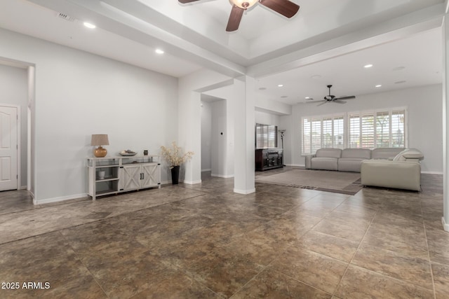 unfurnished living room with ceiling fan