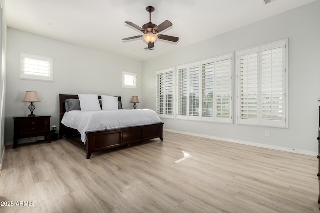 bedroom featuring light hardwood / wood-style flooring and ceiling fan