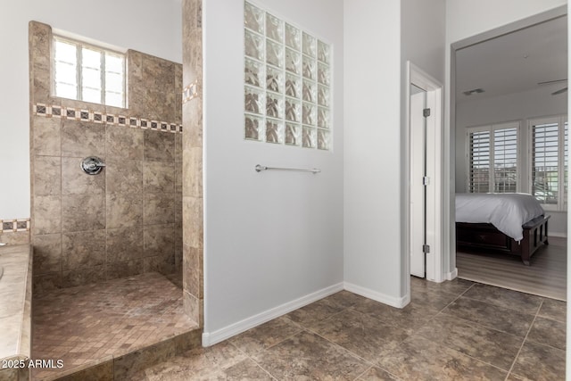 bathroom with tiled shower