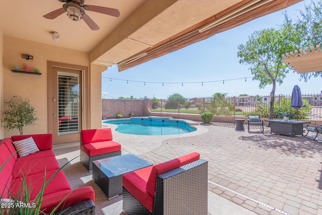 view of swimming pool featuring outdoor lounge area, ceiling fan, and a patio area