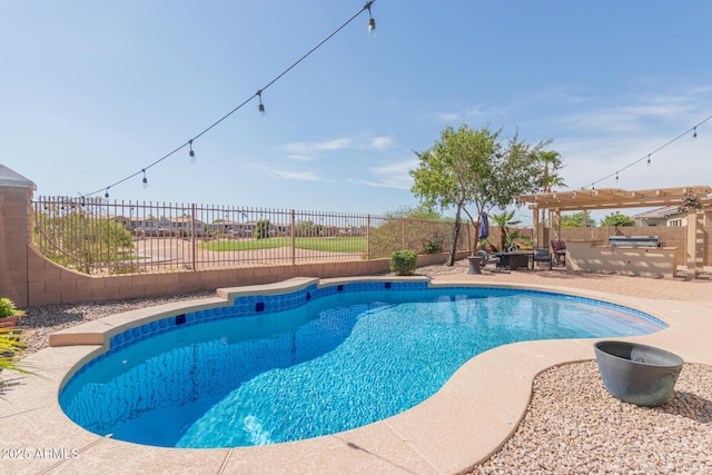 view of swimming pool featuring a patio area and a pergola