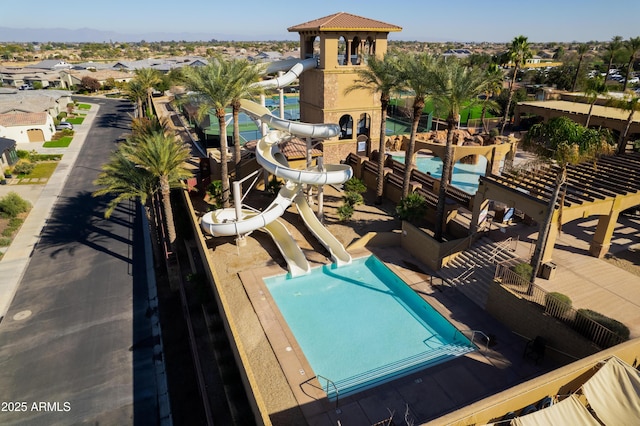 view of swimming pool featuring a water slide