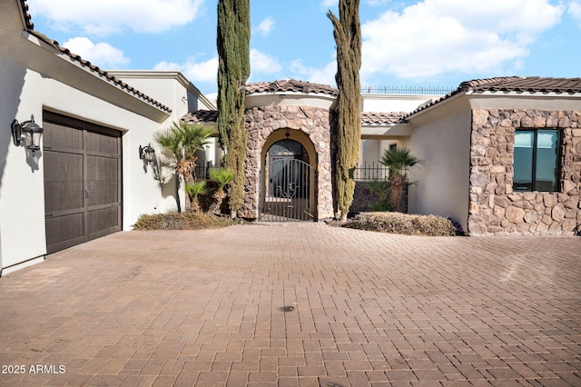 mediterranean / spanish-style home featuring a garage