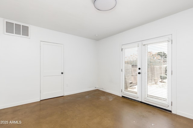 empty room featuring french doors