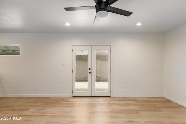 unfurnished room with light hardwood / wood-style floors, french doors, and ceiling fan