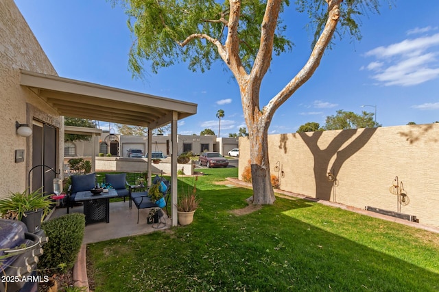 view of yard with a patio and fence