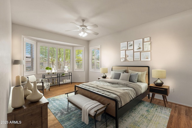 bedroom featuring wood-type flooring and ceiling fan