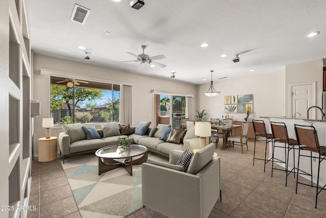 living room featuring ceiling fan