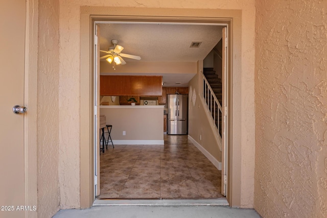 hall featuring visible vents and stairs