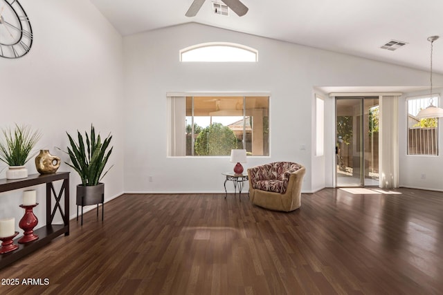 unfurnished room featuring dark hardwood / wood-style flooring, ceiling fan, and vaulted ceiling