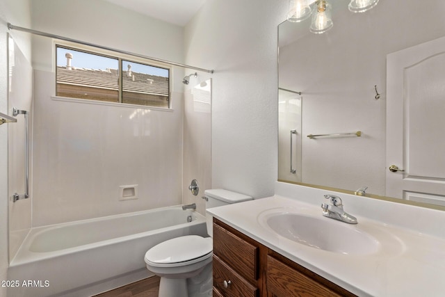 full bathroom featuring toilet, hardwood / wood-style flooring, shower / washtub combination, and vanity