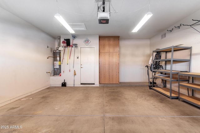 garage featuring gas water heater and a garage door opener