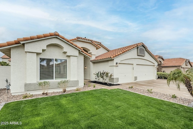 mediterranean / spanish house with a tile roof, stucco siding, a front yard, a garage, and driveway