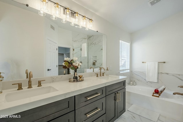 full bathroom with marble finish floor, a sink, and visible vents