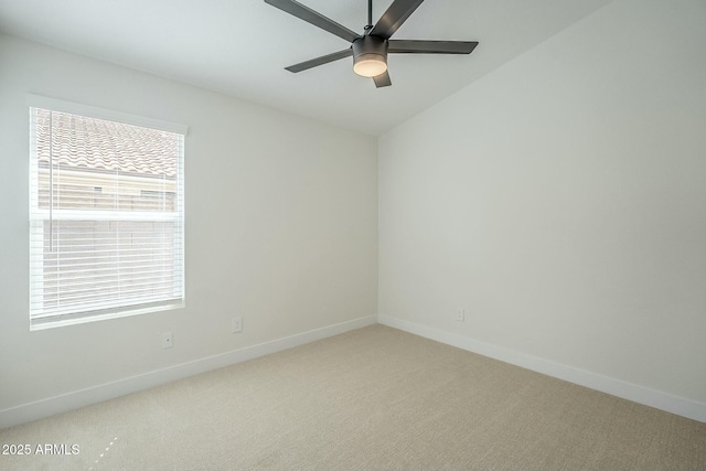 empty room with light carpet, ceiling fan, and baseboards