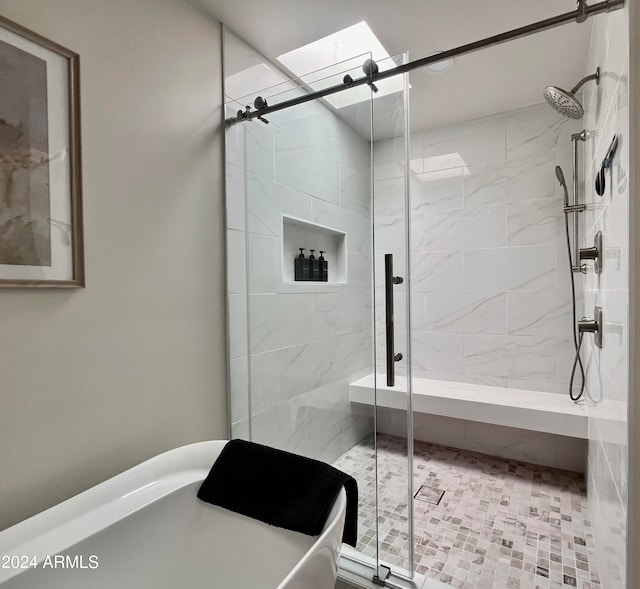 bathroom featuring a shower with door