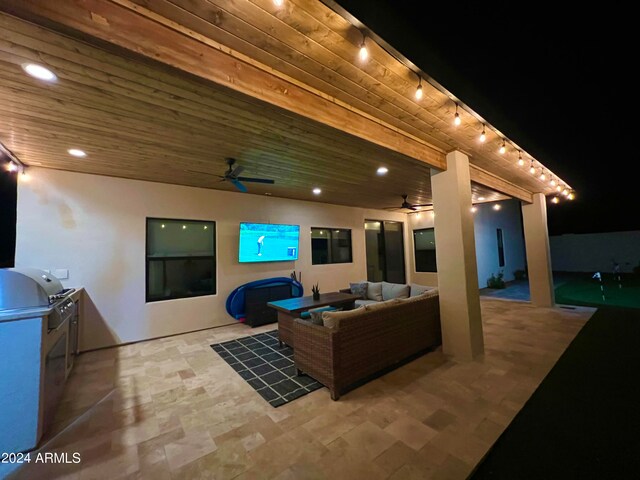 tiled living room with ceiling fan