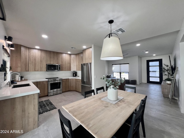 dining space featuring sink