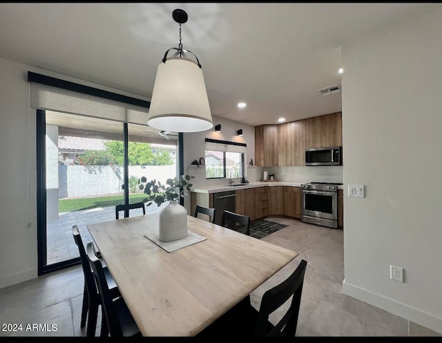 tiled dining space with sink