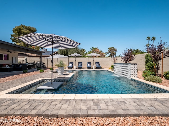 view of swimming pool with a ceiling fan, a fenced in pool, outdoor lounge area, a patio area, and a fenced backyard