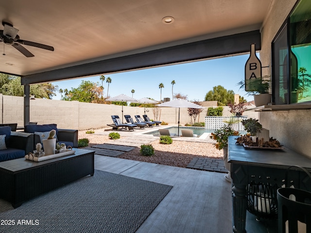 view of patio / terrace with a fenced backyard, an outdoor hangout area, and a ceiling fan