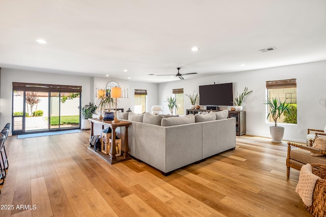 living area with recessed lighting, light wood-style floors, ceiling fan, and visible vents