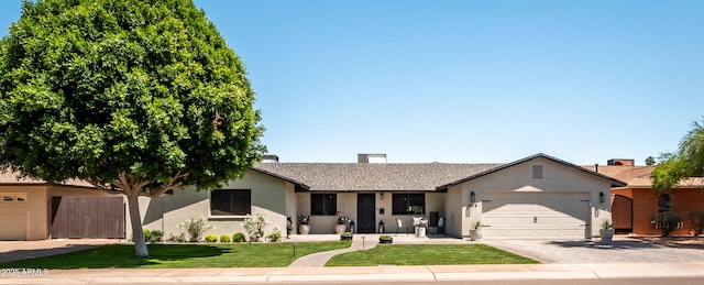 ranch-style home featuring a garage, stucco siding, fence, a front lawn, and driveway