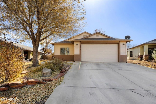 ranch-style house featuring a garage