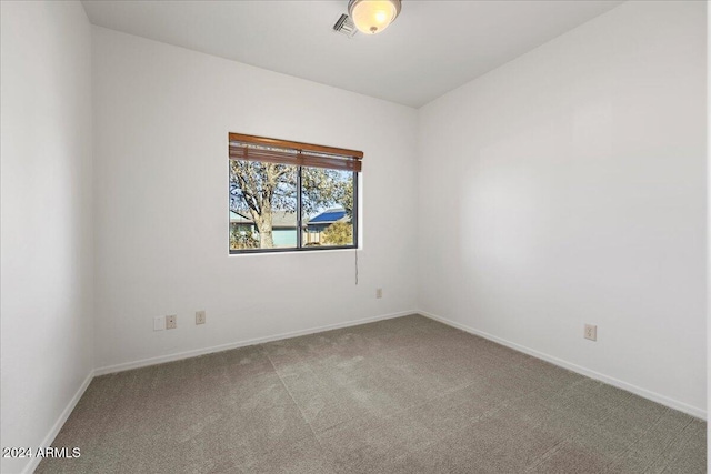 unfurnished room featuring carpet flooring