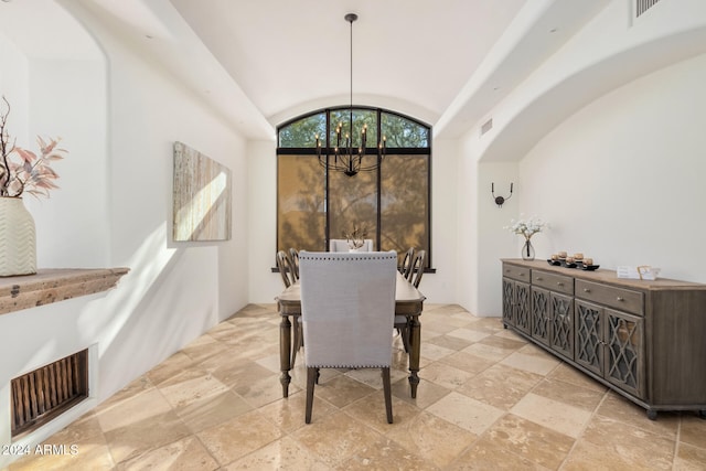 dining area featuring lofted ceiling