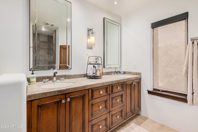 bathroom featuring tile patterned flooring and vanity