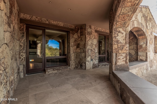 property entrance featuring a patio