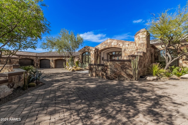 view of front of property with a garage