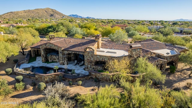 birds eye view of property featuring a mountain view