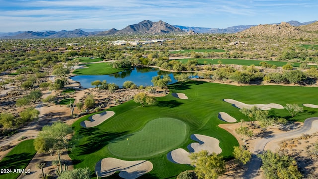 birds eye view of property featuring a water and mountain view