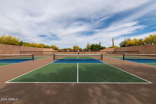 view of sport court with basketball hoop