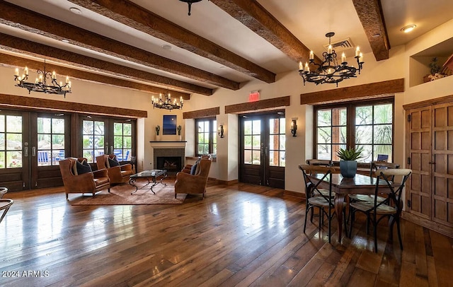 interior space featuring beam ceiling, dark hardwood / wood-style flooring, french doors, and plenty of natural light