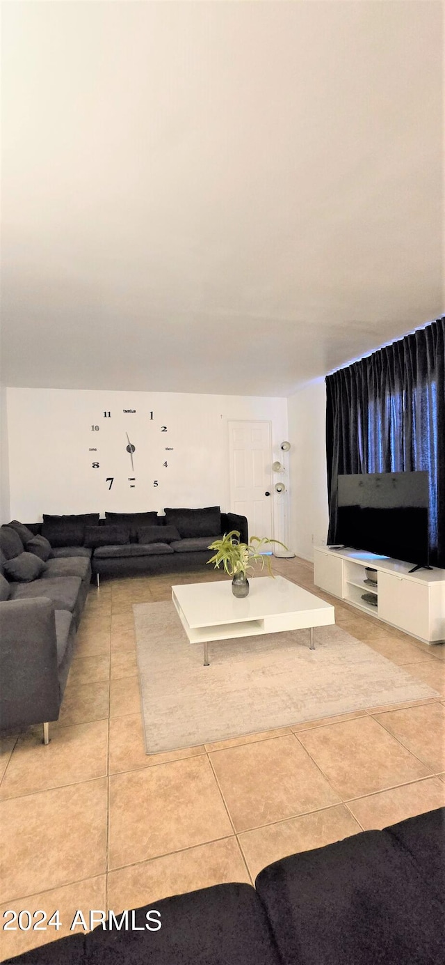 living room with light tile patterned floors