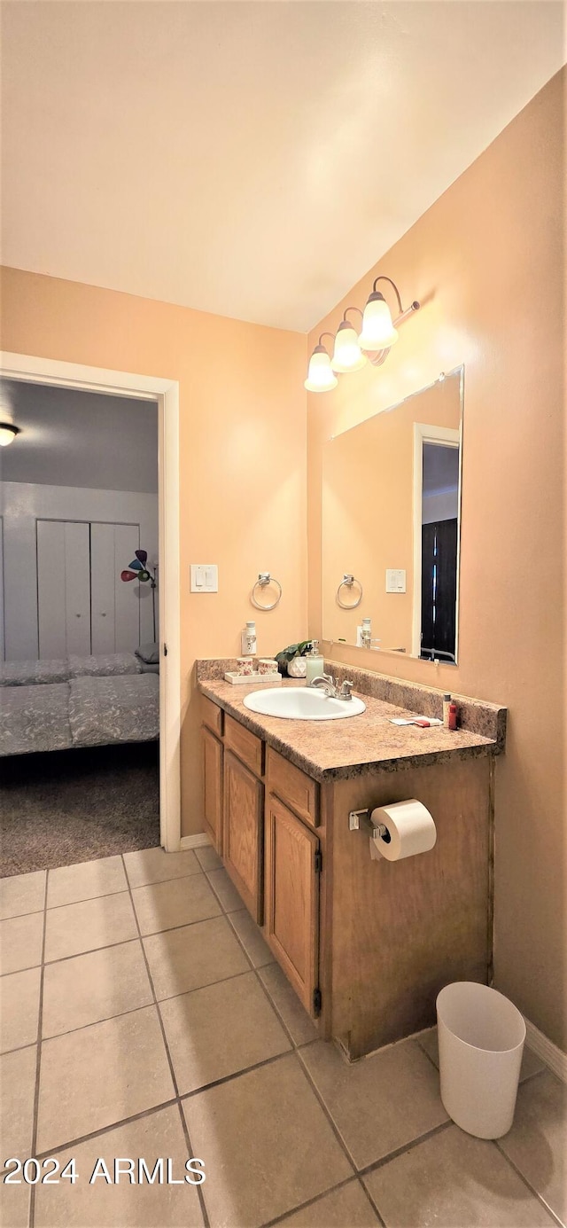 bathroom with vanity and tile patterned flooring