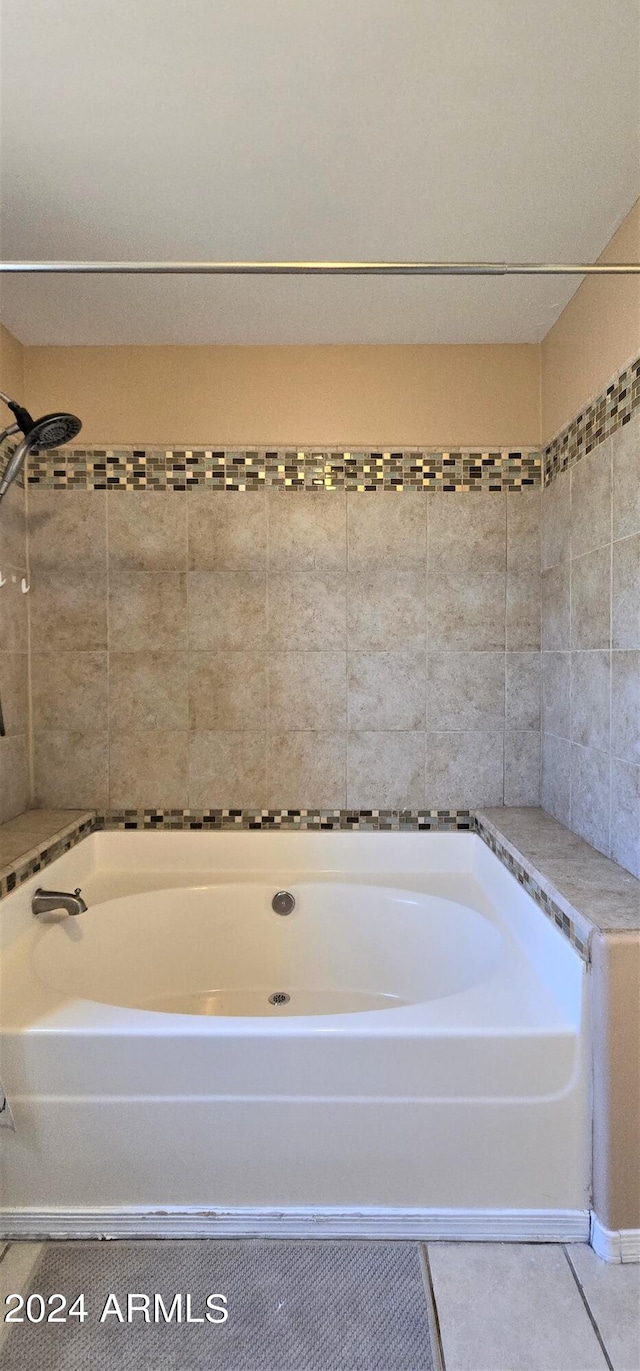 bathroom featuring tile patterned flooring and shower / washtub combination