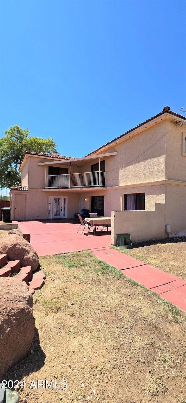 back of house featuring a patio area